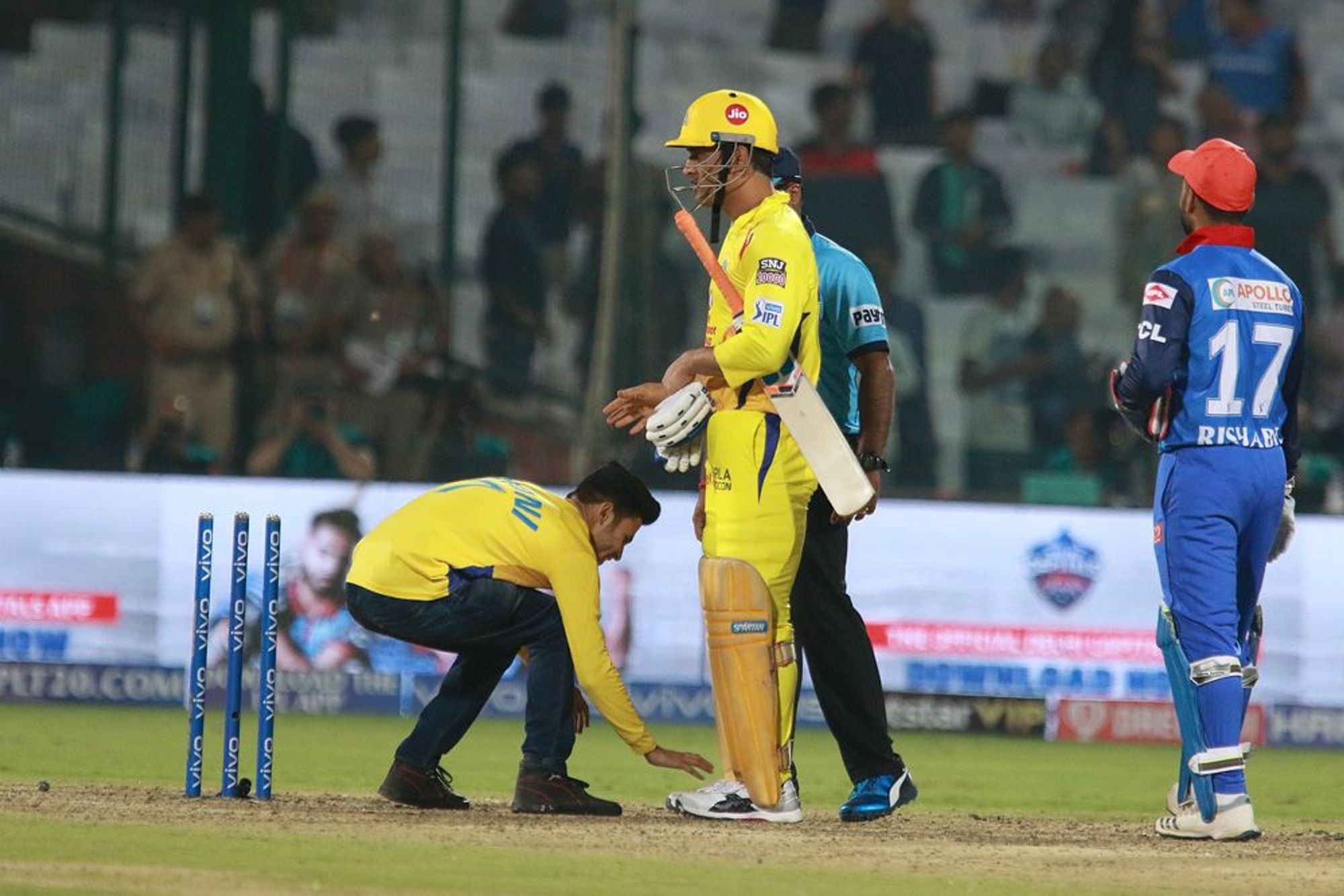 Meanwhile, a couple of fans breached the security and entered the field to touch Dhoni’s feat