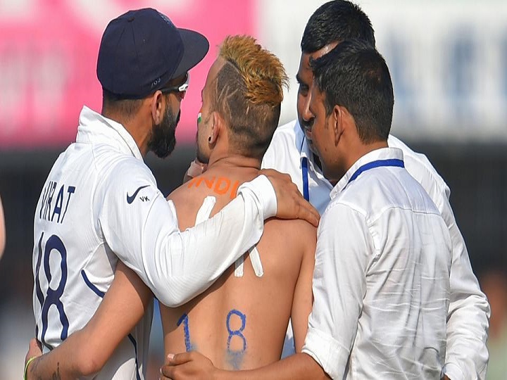 ind vs ban 1st test die hard kohli fan manages to sneak onto field gets side hug from indian skipper watch IND vs BAN, 1st Test: Die Hard Kohli Fan Manages To Sneak Onto Field, Gets Side-hug From Indian Skipper | Watch